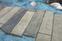 Randall Klassen, of Winnipeg, Manitoba, sent us these photos of a monolithically poured concrete "bridge" over concrete "water" he constructed for Seven Oaks School Division, in northwest Winnipeg.
